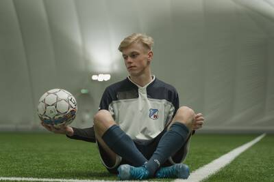 Boy hold soccer ball